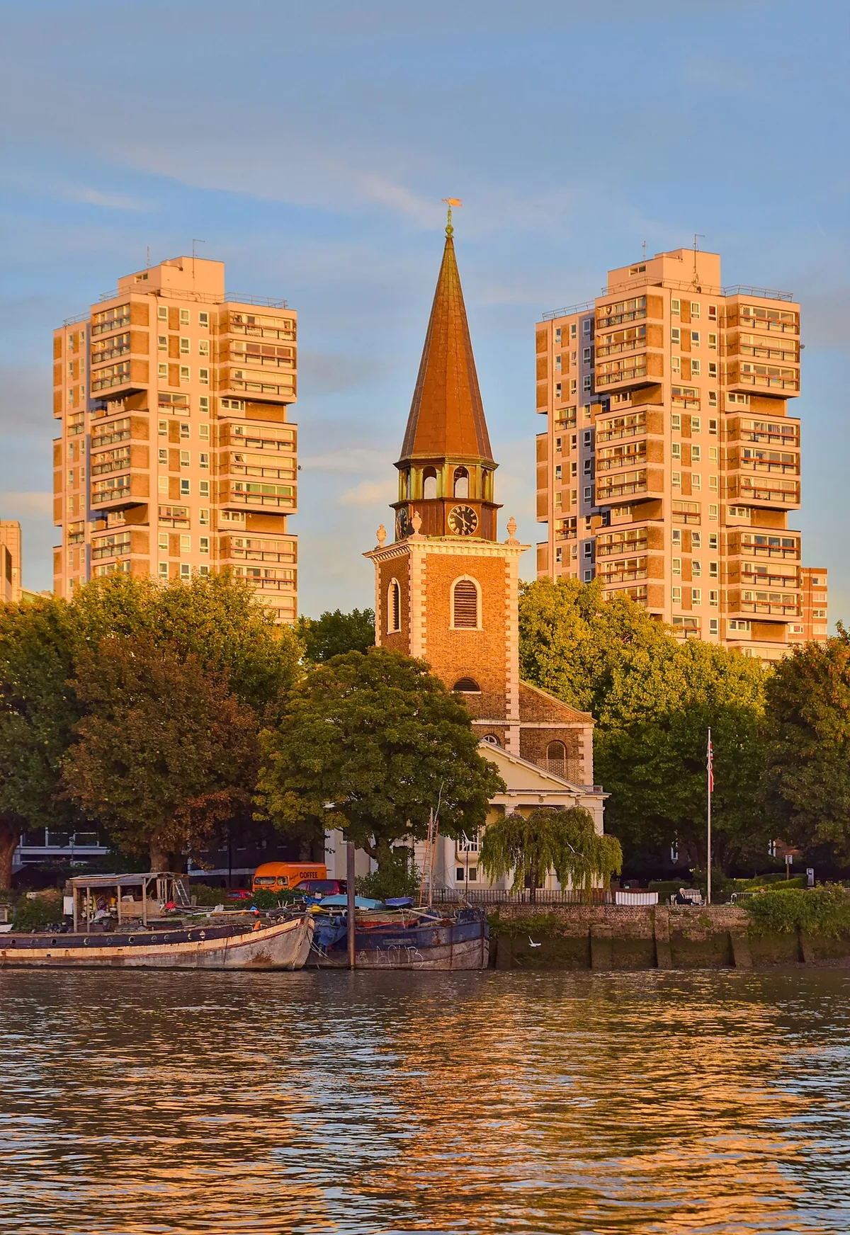 Golden hour view of St. Mary's Church in Battersea flanked by Selworthy House and Sparkford House.
