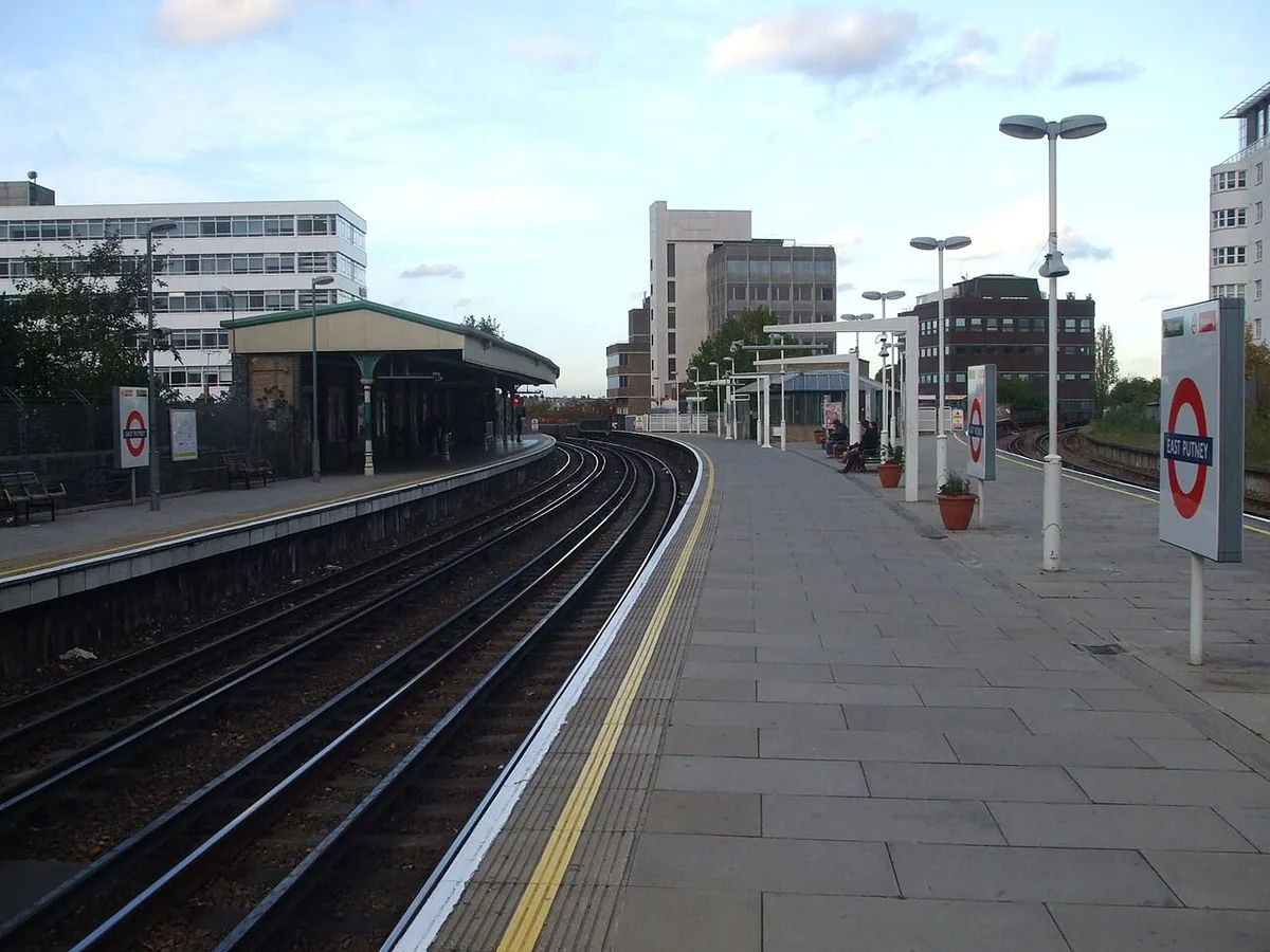 East Putney tube station District line platforms looking north, with the main line branch from Wandsworth town visible on the right.