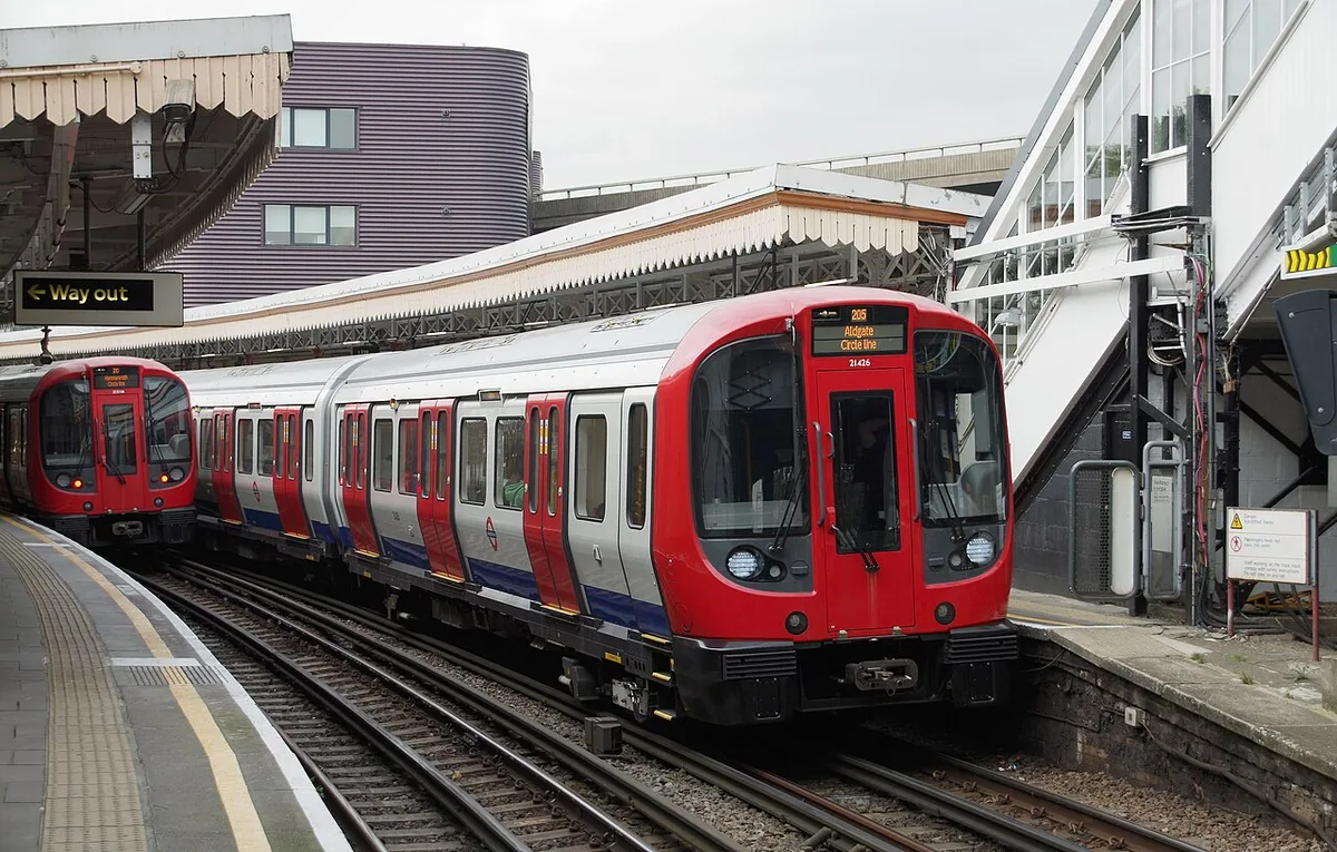 A London Underground S Stock EMUs pass at Westbourne Park.